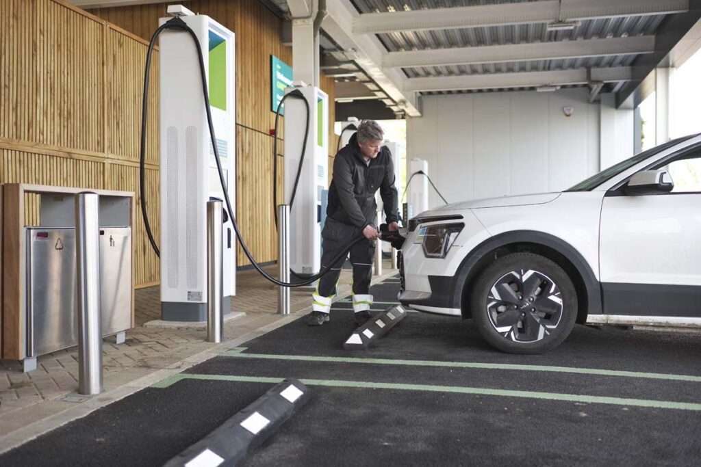 Men charging his electric car