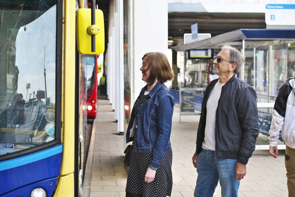 This is an image of a lady and a man catching the bus at Great Yarmouth bus station.