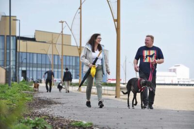 couple walking the dog in Great Yarmouth